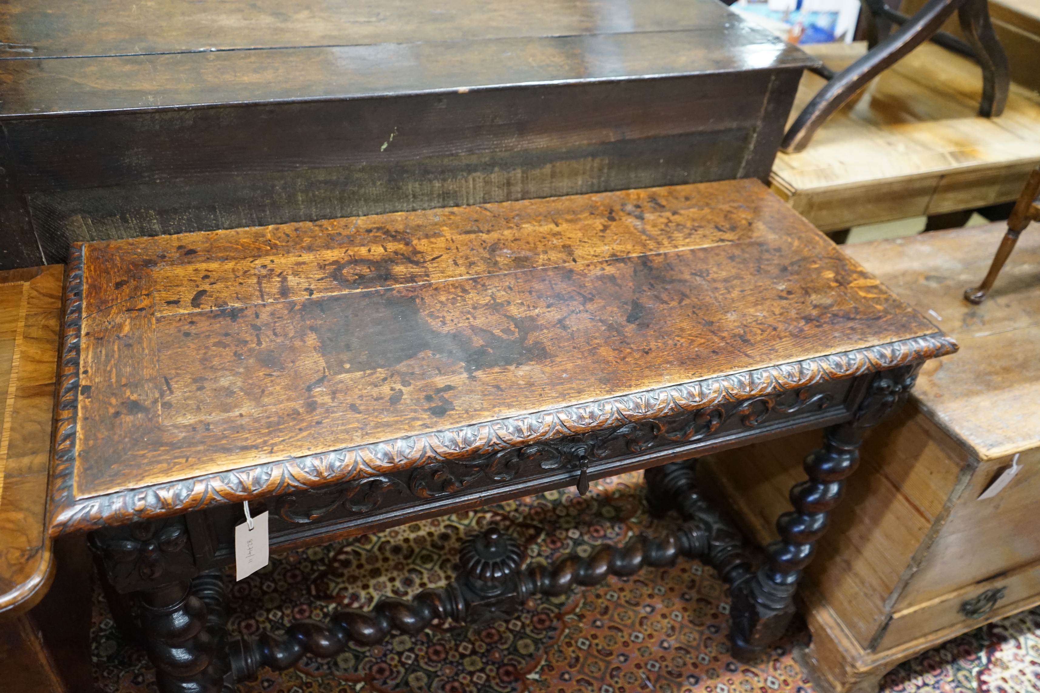 A late 19th century Flemish carved oak side table, width 100cm, depth 45cm, height 75cm
